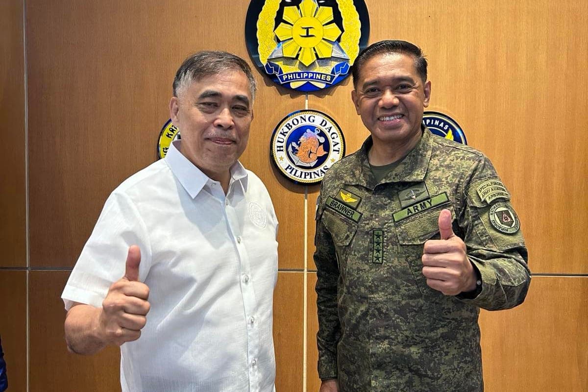 The Foundation's Chairman standing with the Chief of Staff of the Armed Forces of the Philippines before the AFP seal.